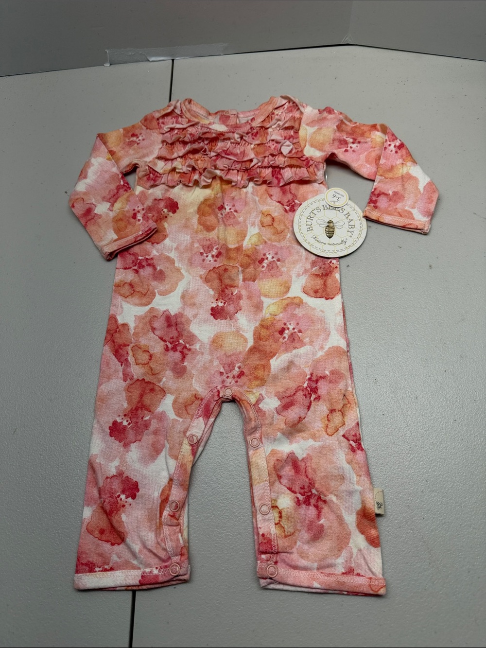 Burt’s Bees Floral Ruffle Long-Sleeve One-Piece Bodysuit in Pink. NWT